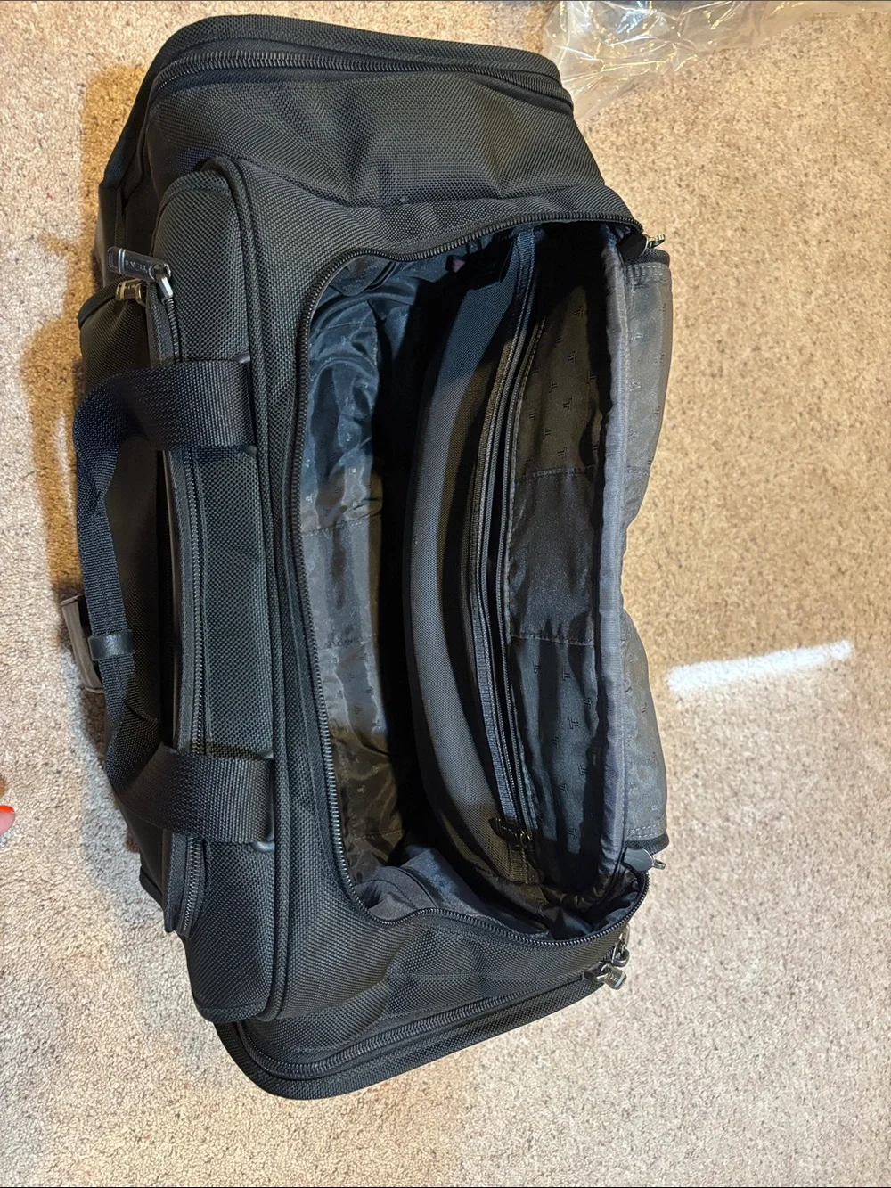 Tumi Black Rolling Carry-On Duffel with Wheels and handle